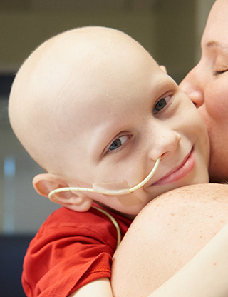 BCCH patient, Connor is embraced and kissed by his mom