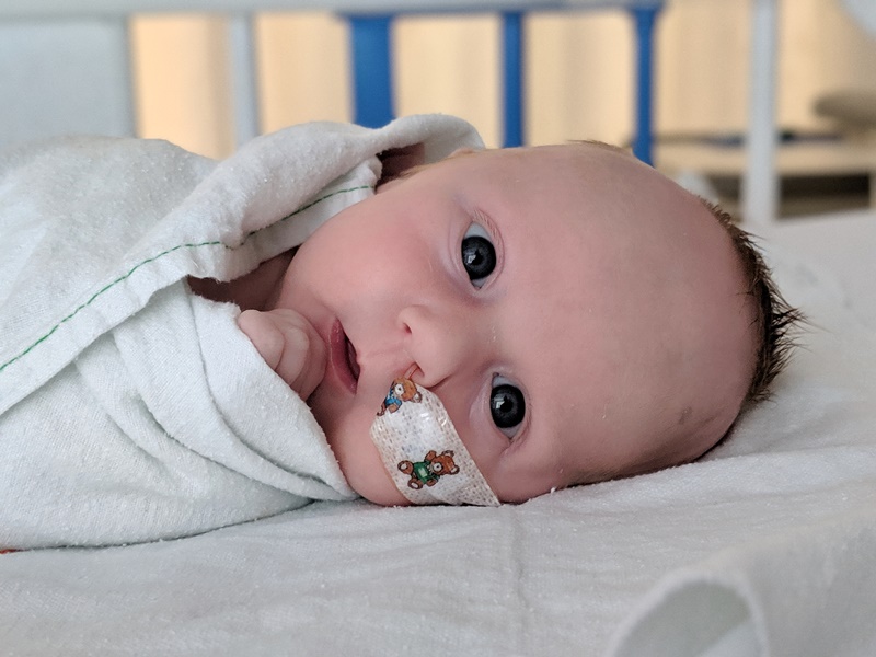 baby Quinn lies in her hospital bed