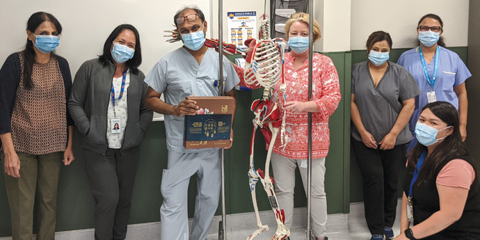 Orthopedic surgeon Dr. Kishore Mulpurri and members of BC Children's orthopedic team, showcase a Mid Autumn Festival for Children mooncake set