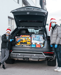 Landon and Bear pose with a trunk full of goodies for BC Children's Hospital