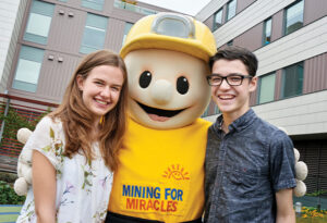Buddy the Miner with patients Taylin & Colton